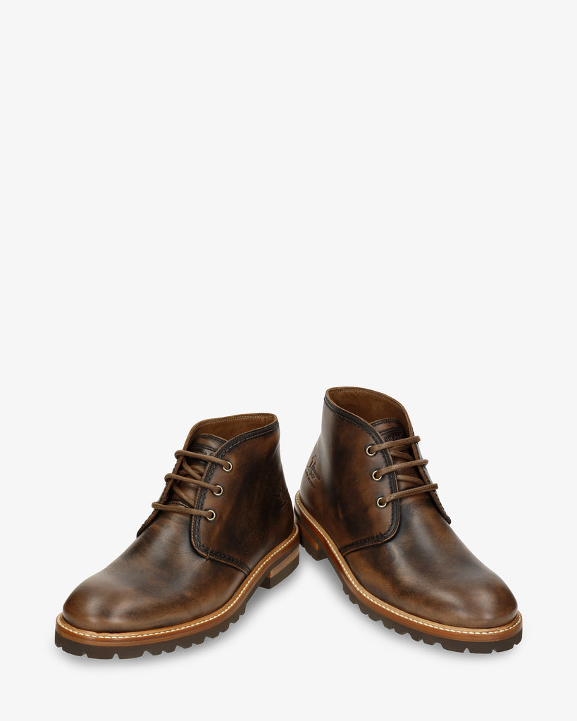 Erick botín de piel con forro interior de piel. cuero