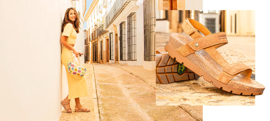 Chica apoyada en pared con sandalia Selma cuero